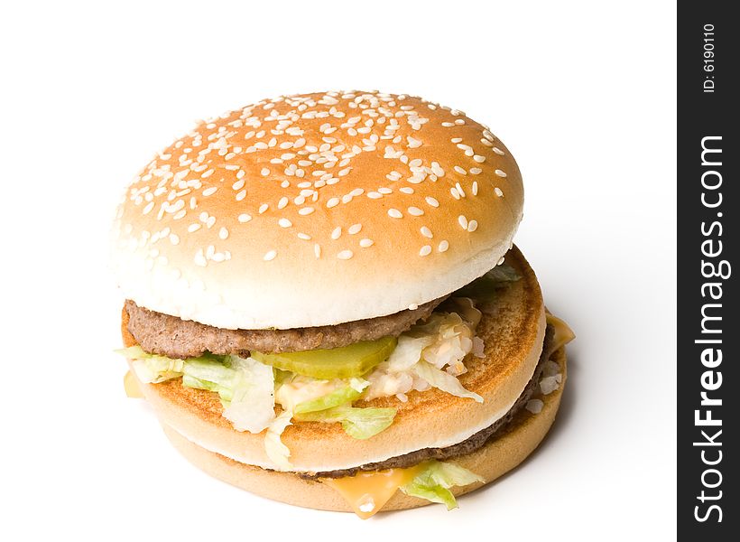 Bread with fried meat, cheese, onion and lettuce isolated on a  white background. Bread with fried meat, cheese, onion and lettuce isolated on a  white background.