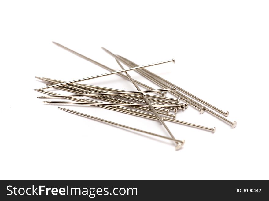 A pile of pins isolated on white background.