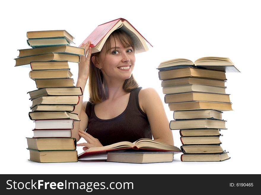 young woman and a pile of books