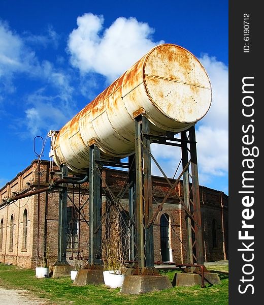 An old and rusty water tank. An old and rusty water tank.