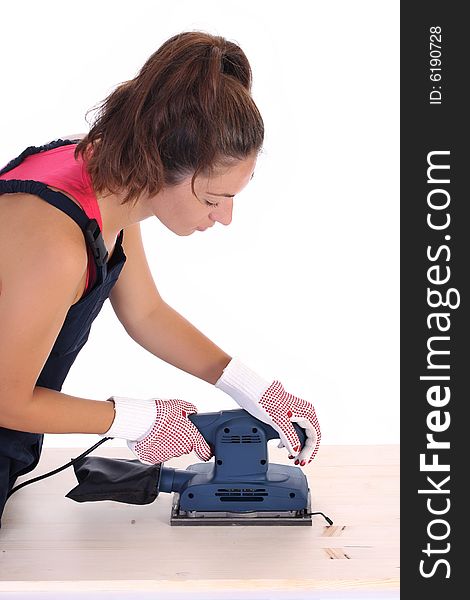 Woman carpenter at work on white background