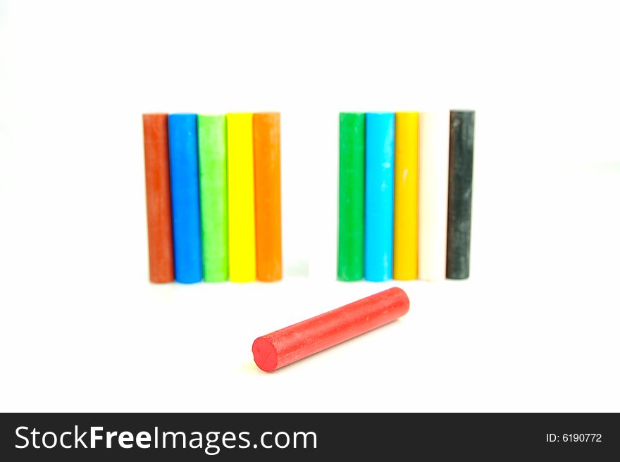 Oil pastels/crayons isolated against a white background