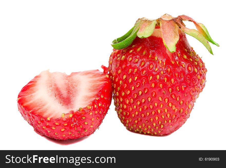 Close-up whole and half strawberries, isolated on white