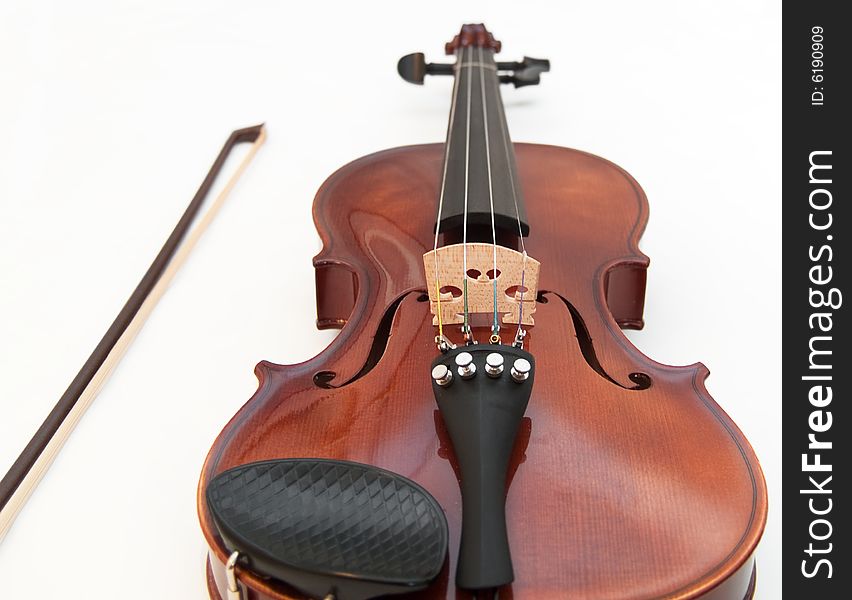 Violin and a bow, isolated on a white background. Violin and a bow, isolated on a white background.