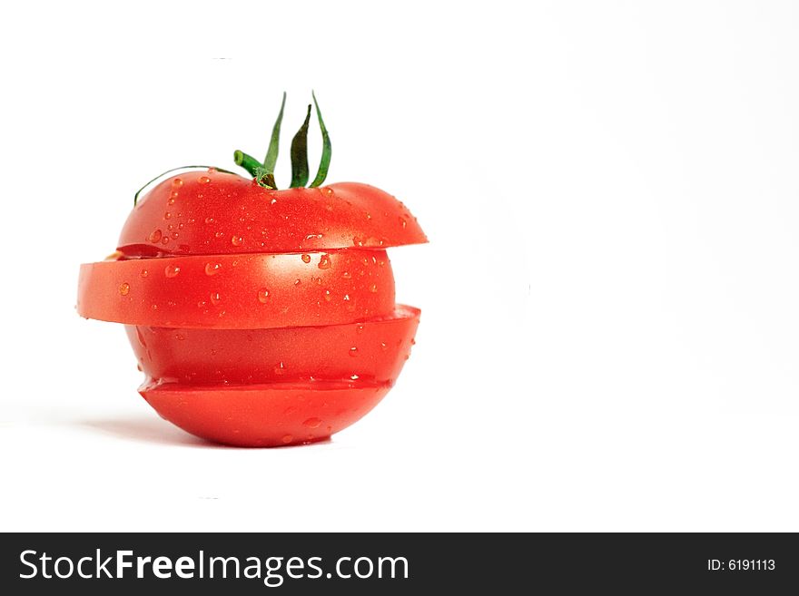 Sliced ripe tomato slices on a white background