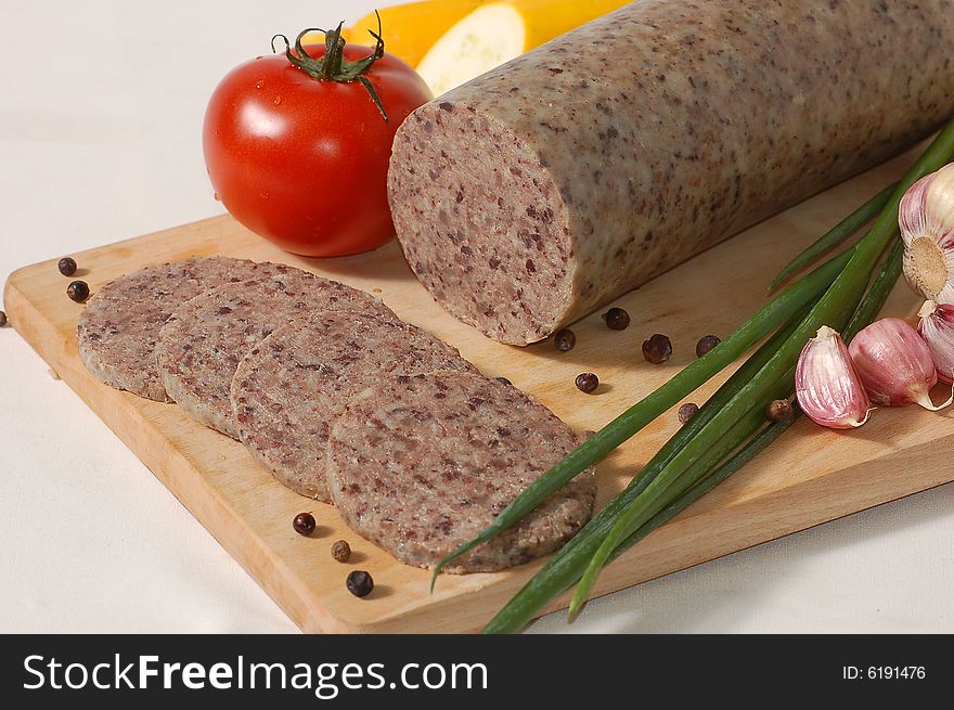 Meat with vegetables on the chopping board. Meat with vegetables on the chopping board