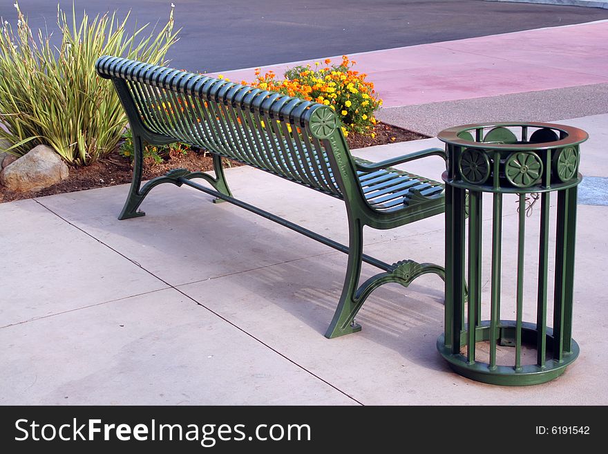 Back Of A Park Bench And Trash Can