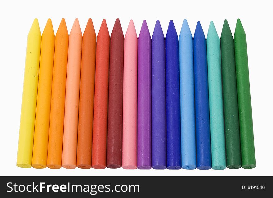 Differently colored crayons on white background