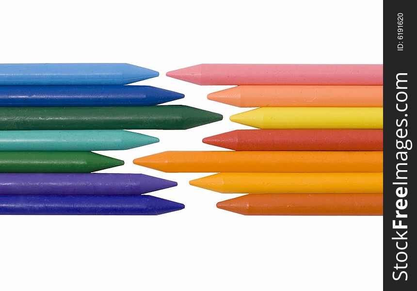 Differently colored crayons on white background