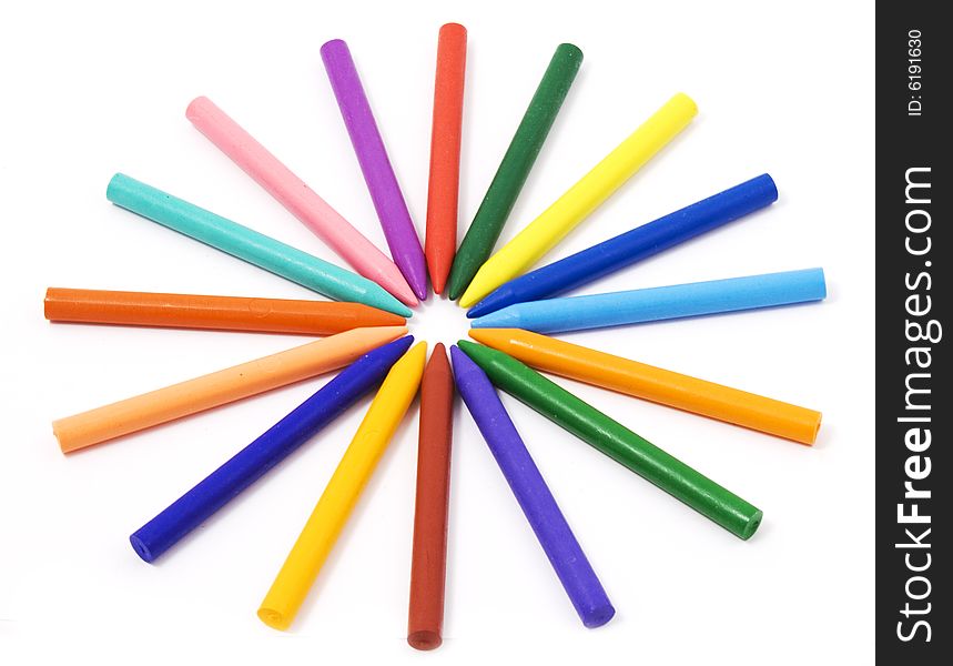 Differently colored crayons on white background