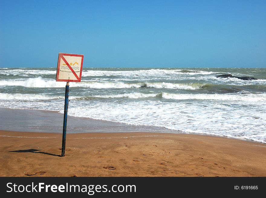 No swim sign on the Caspian sea shore