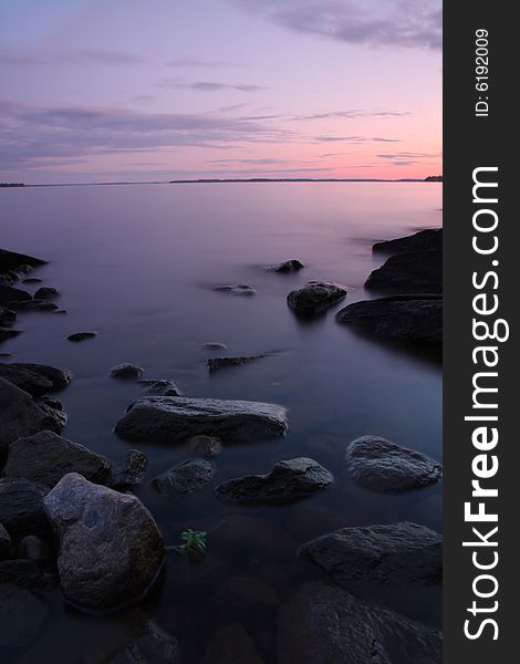 Sunset by the lake, rocks, long exposure