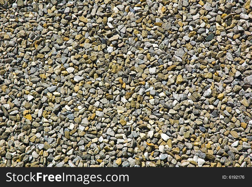 Background texture made of a lot of small colorful stones. Background texture made of a lot of small colorful stones