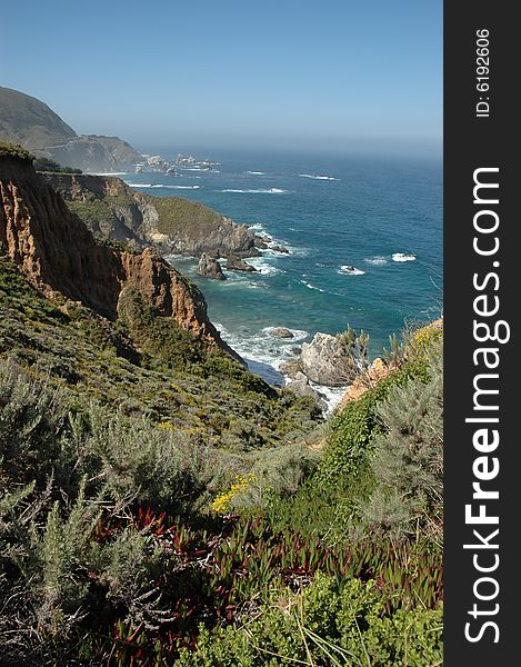 Rugged California coastline showing mountains, vegetation and the ocean