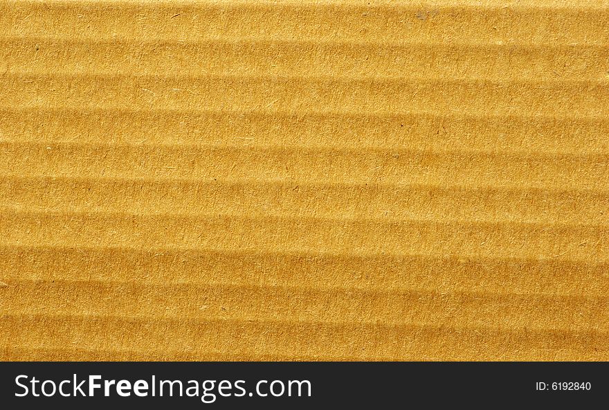 Brown corrugated cardboard sheet background. Brown corrugated cardboard sheet background