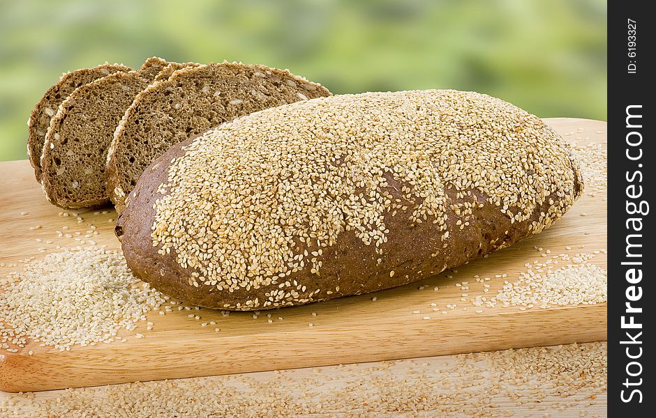 Wholemeal bread topped with sesame seeds. Wholemeal bread topped with sesame seeds