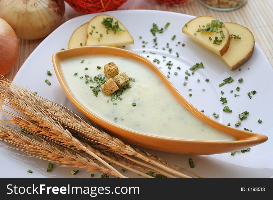 A fresh soup of potatoes with croutons