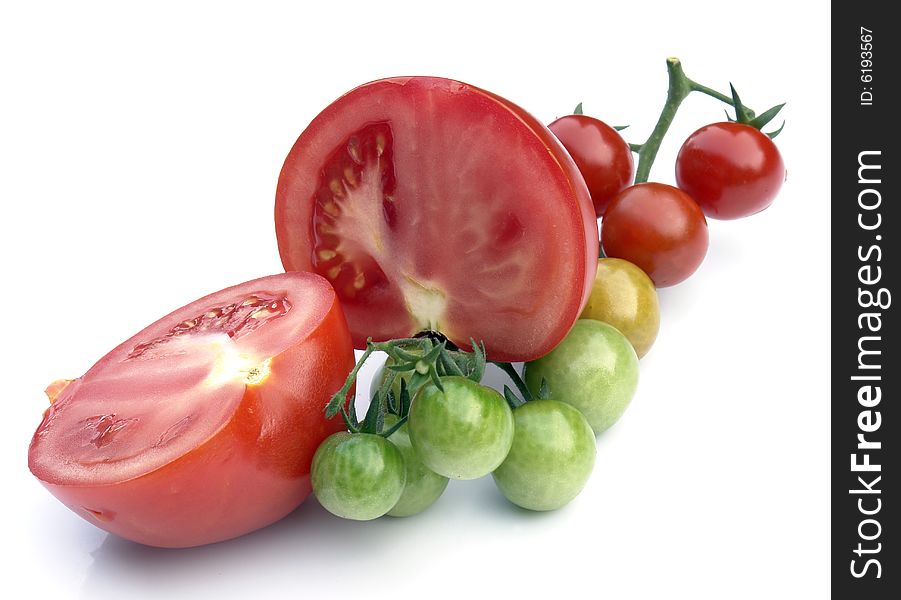 Small and big tomatoes on the white background