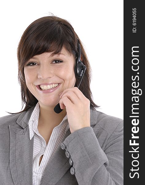 A woman with a headset in a callcenter or a office
