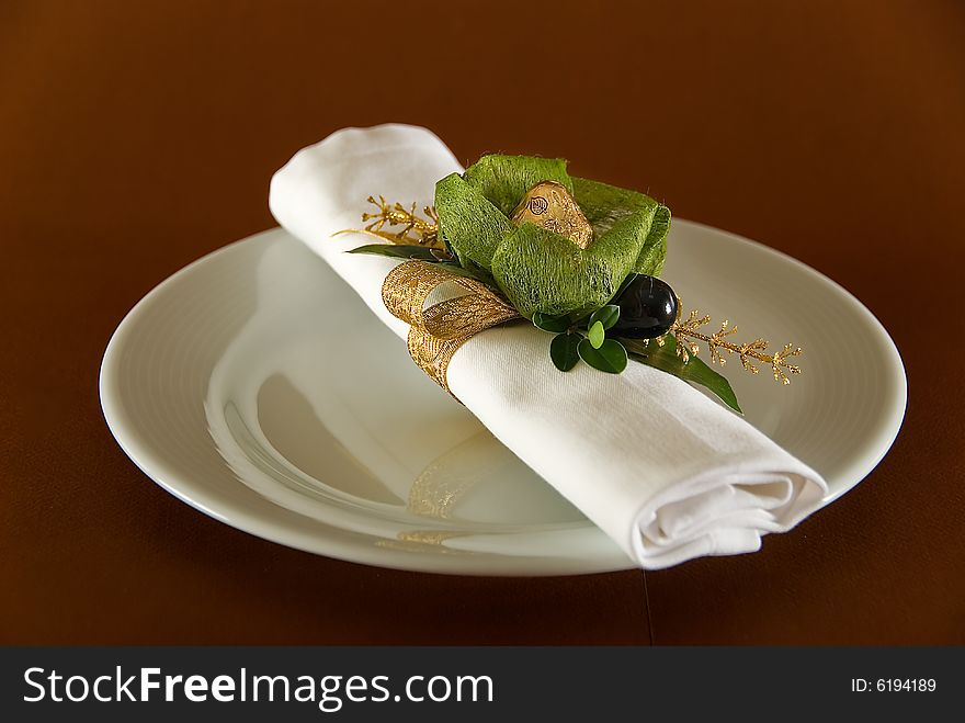 Napkin with sweet on saucer