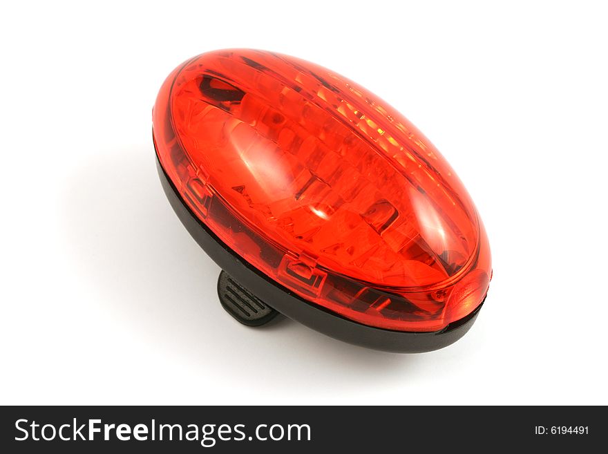 Small bicycle red lamp isolated in studio. Small bicycle red lamp isolated in studio