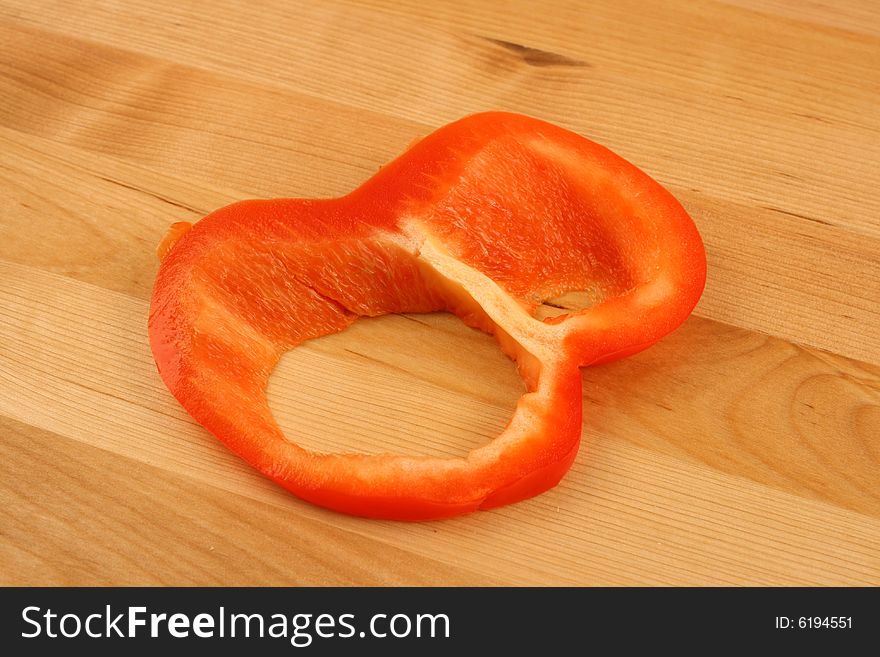 Red pepper on wooden table