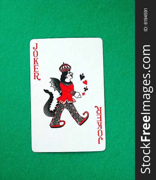 Joker fun poker gambling lucky card on green table