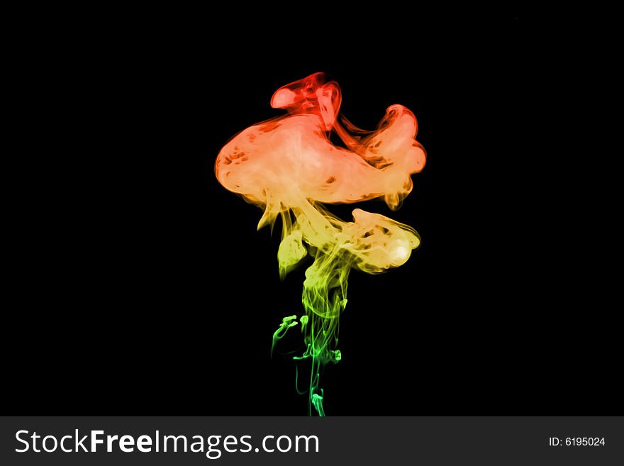 Puff of rainbow smoke. Isolated on black background