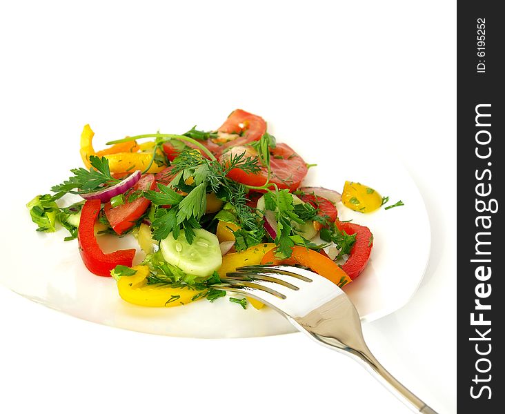 Freshness vegetarian salad and a fork isolated