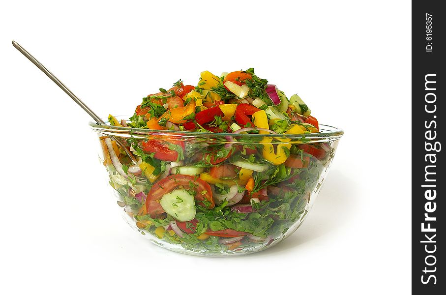 Freshness vegetarian salad in a bowl and fork isolated