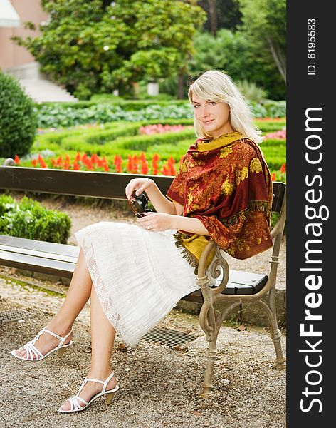 Beautiful young woman relaxing in a park