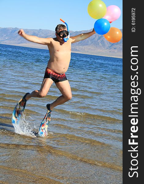 Cheerful man at vacation on sunny beach. Cheerful man at vacation on sunny beach