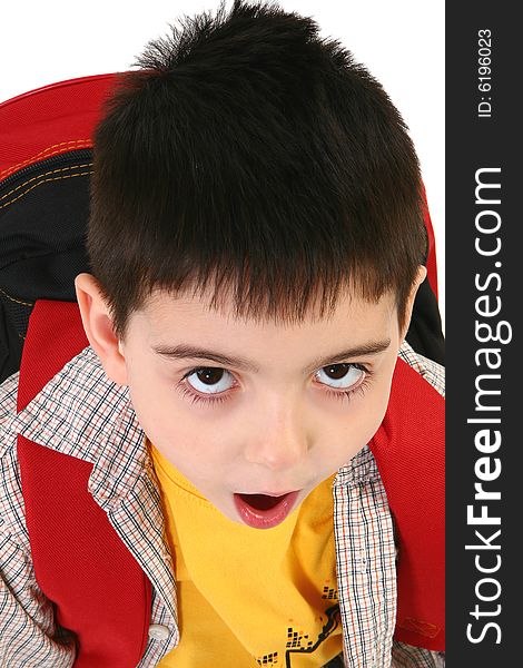 Adorable five year old boy with backpack making tired or surprised expression. Adorable five year old boy with backpack making tired or surprised expression.