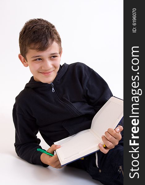 School boy with book in the hands