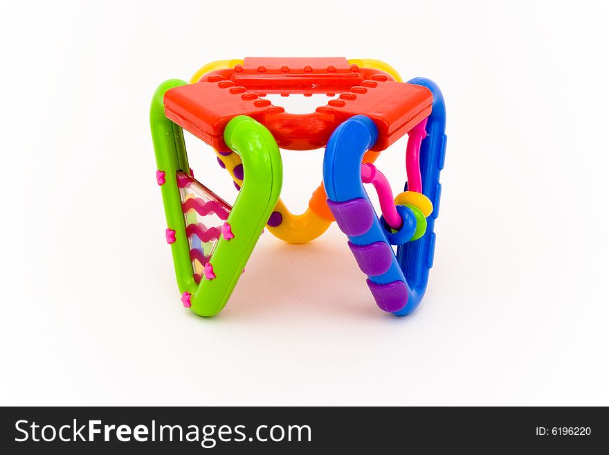 Colored plastic baby toy on a white background