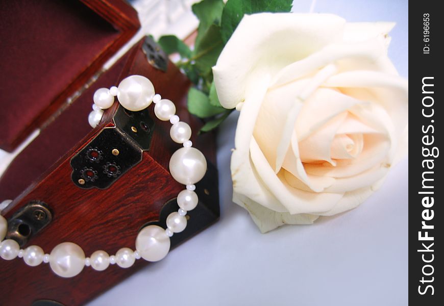 String of pearls in jewelery box and rose. String of pearls in jewelery box and rose