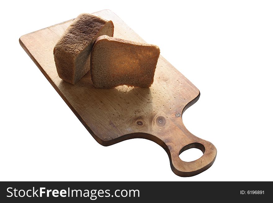 Rye-bread lying on isolated breadboard on white background. Rye-bread lying on isolated breadboard on white background