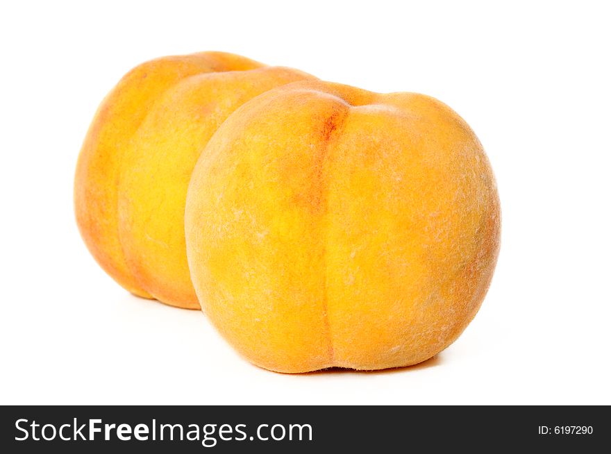 Close-up of peaches, isolated on white background