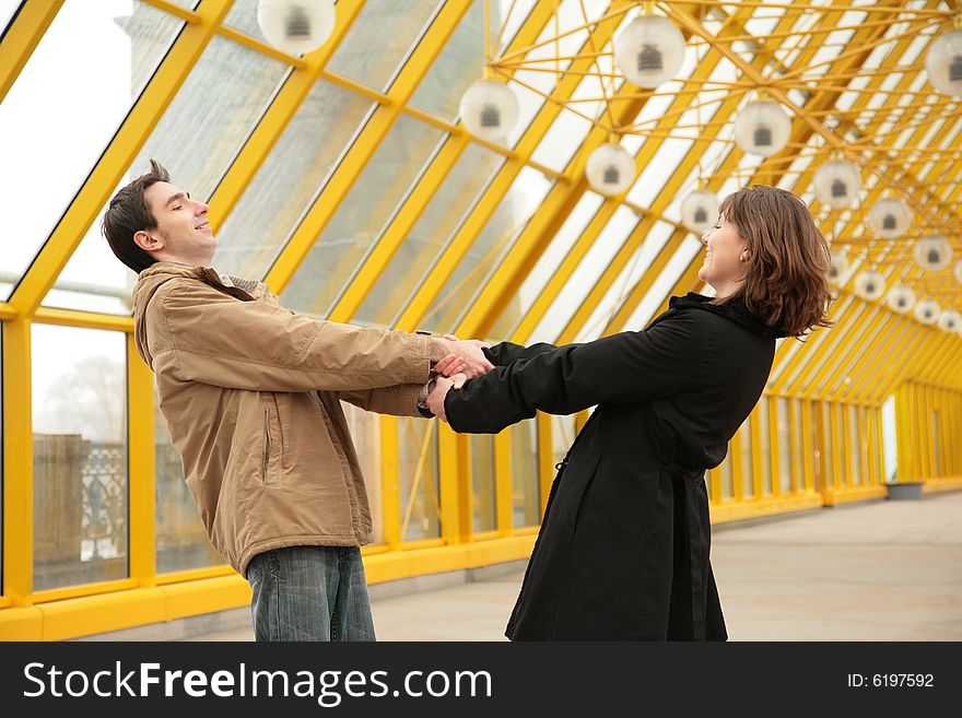 The boy and girl hold each other for hands