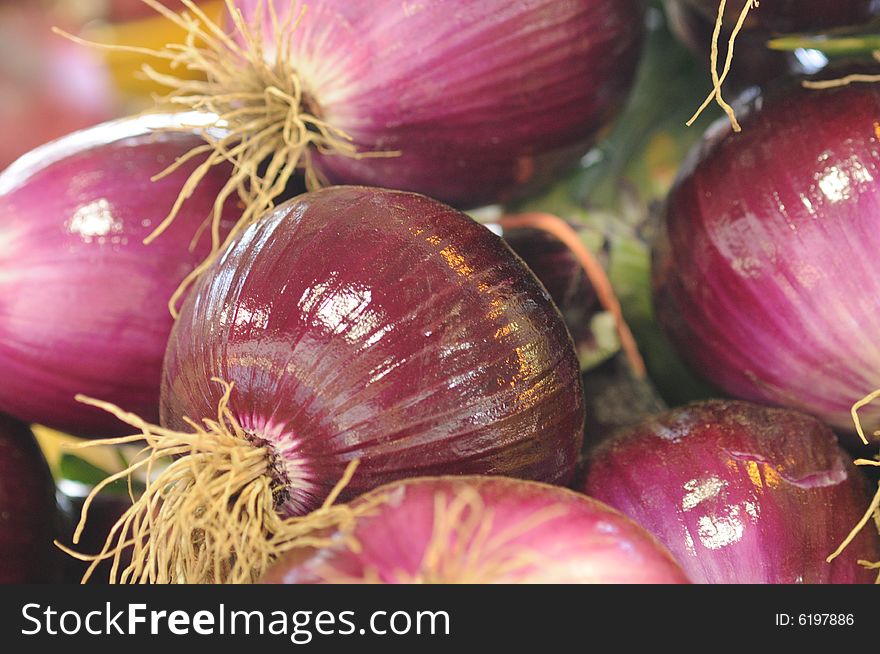 Red onions in a market