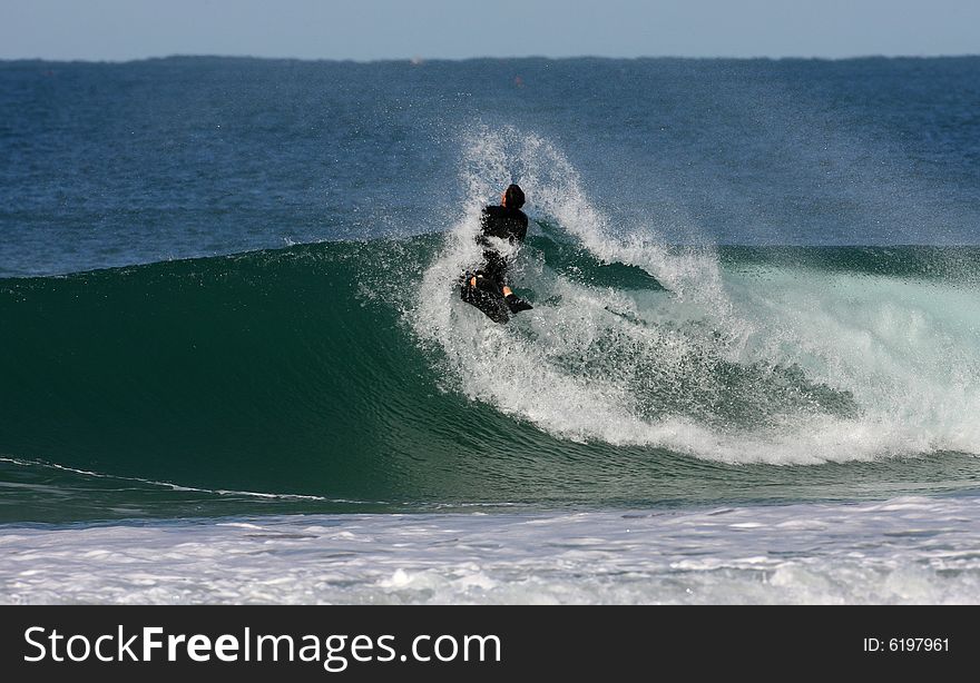 bodyboarder on top of the wave