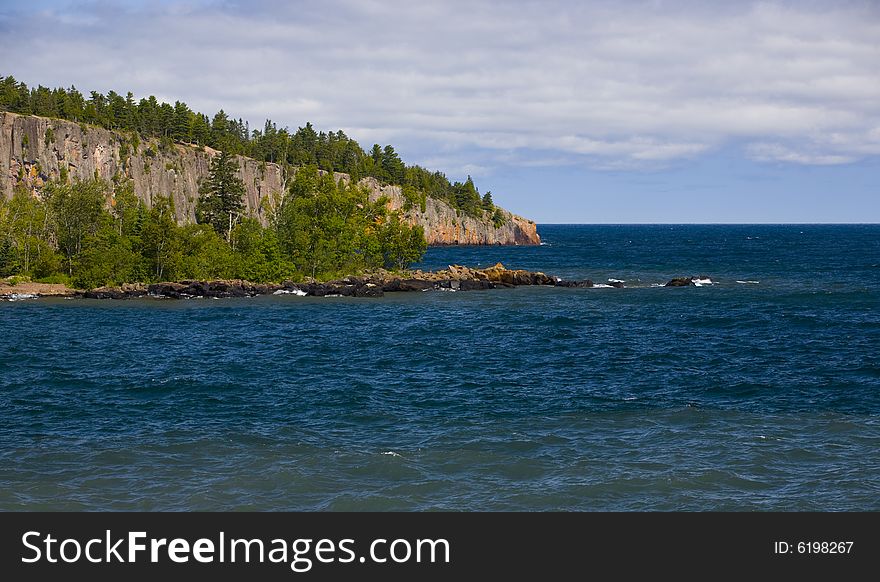 Shovel point and blue water along the North Shore of Lake Superior. Shovel point and blue water along the North Shore of Lake Superior