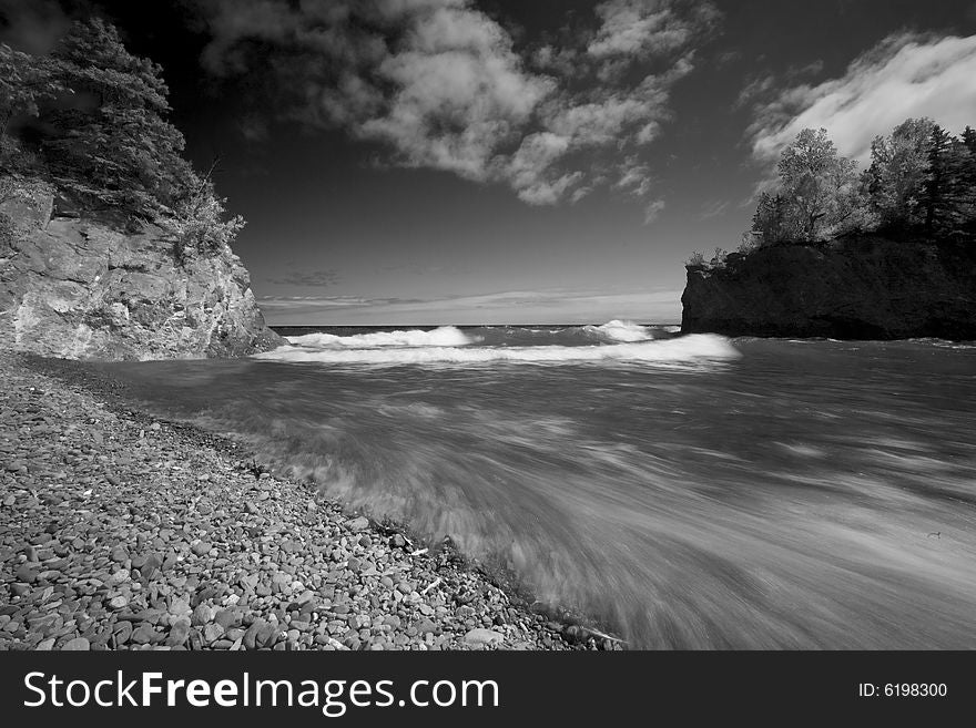 Waves explode into the mouth of the Baptism river along the North Shore of Lake Superior. Waves explode into the mouth of the Baptism river along the North Shore of Lake Superior.