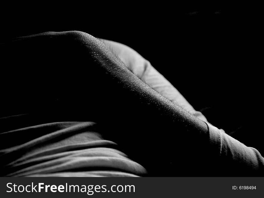 A black and white photo of a mans arm