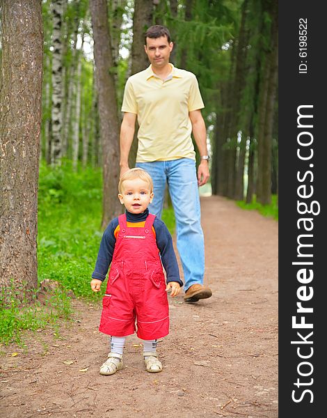 The father and son in park