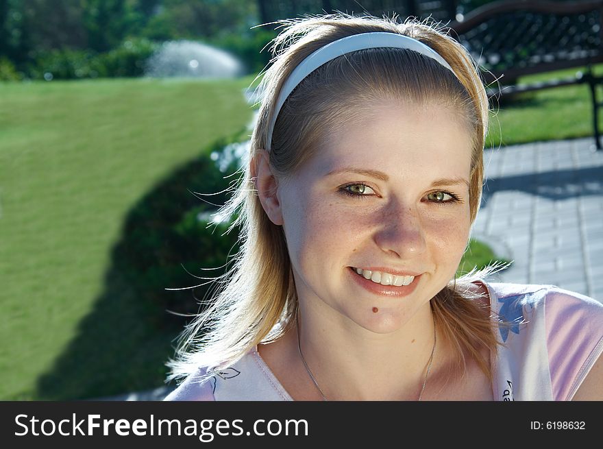 Portrait Of The Young Woman In Park