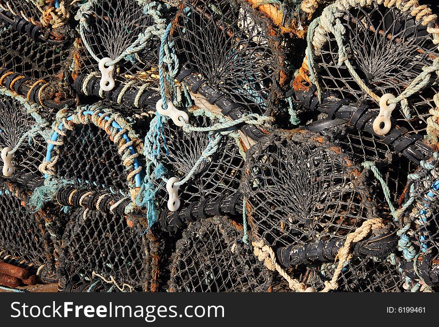 Cornish lobster pots on the harbour wall