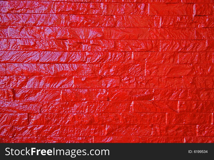 Painted red brick shiny wall. Painted red brick shiny wall