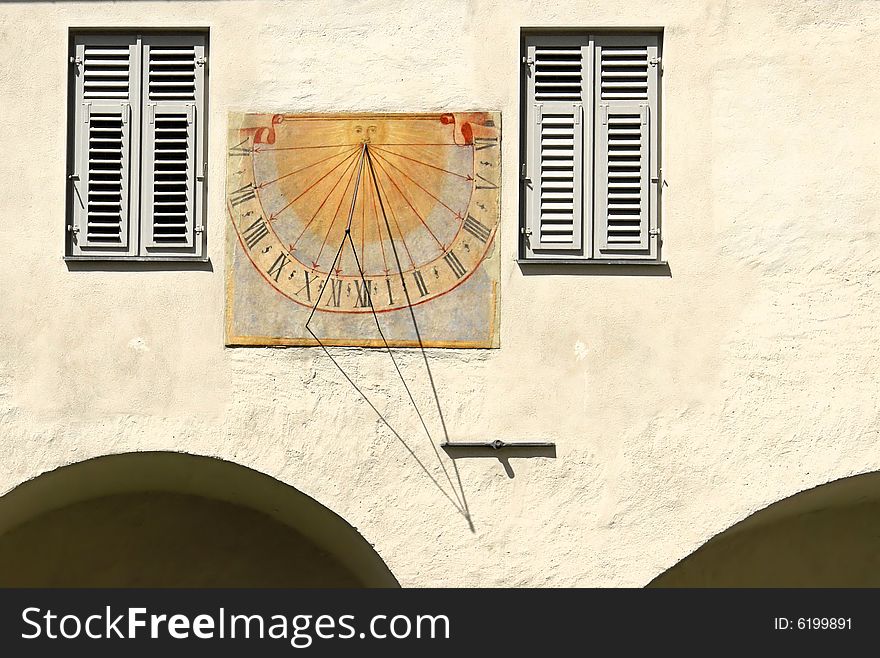 Old colorful solar clock on a house. Old colorful solar clock on a house