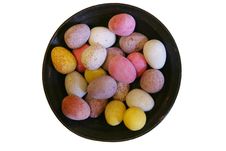 Mini Candy Chocolate Eggs In A Round Dish (isolated) Royalty Free Stock Images